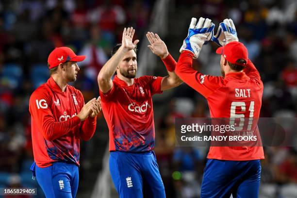 Chris Woakes , Will Jacks and Chris Salt of England celebrate the dismissal of Nicholas Pooran of the West Indies during the 5th T20I between the...