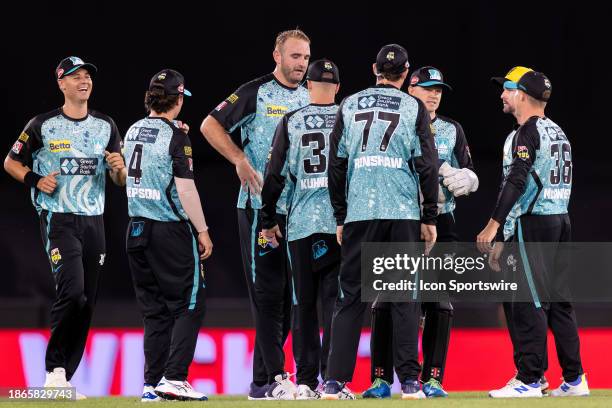 Brisbane Heat players celebrate the fall of a wicket during KFC Big Bash League T20 match between Melbourne Renegades and Brisbane Heat at the Marvel...