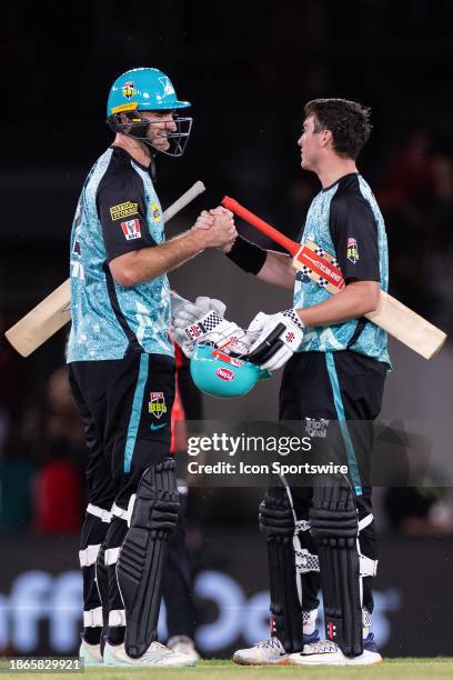 Brisbane Heat players Paul Walter and Matt Renshaw shake hands after KFC Big Bash League T20 match between Melbourne Renegades and Brisbane Heat at...