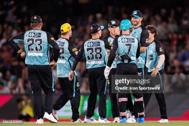 Brisbane Heat players celebrate the fall of a wicket during KFC Big Bash League T20 match between Melbourne Renegades and Brisbane Heat at the Marvel...