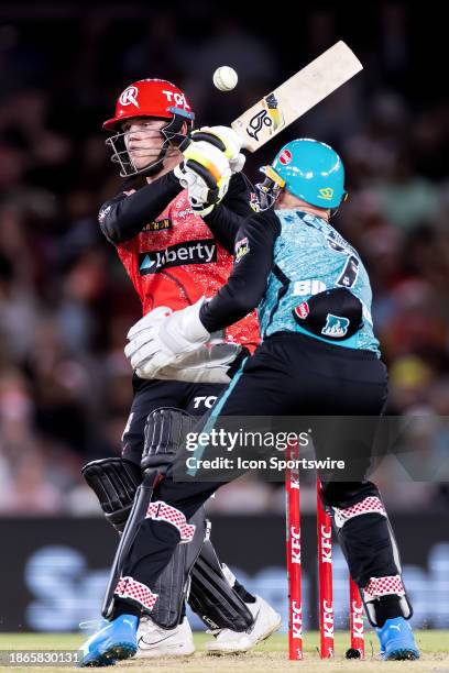 Melbourne Renegades player Jake Fraser-McGurk mishits the ball during KFC Big Bash League T20 match between Melbourne Renegades and Brisbane Heat at...