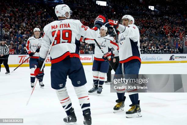 Anthony Mantha of the Washington Capitals is congratulated by Alex Ovechkin after scoring a goal during the fist period of the game against the...