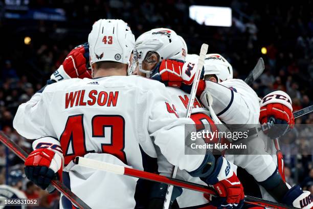 Anthony Mantha of the Washington Capitals is congratulated by Tom Wilson and Alex Ovechkin after scoring a goal during the first period of the game...