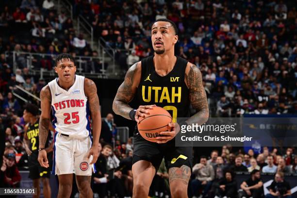 John Collins of the Utah Jazz prepares to shoot a free throw during the game against the Detroit Pistons on December 21, 2023 at Little Caesars Arena...