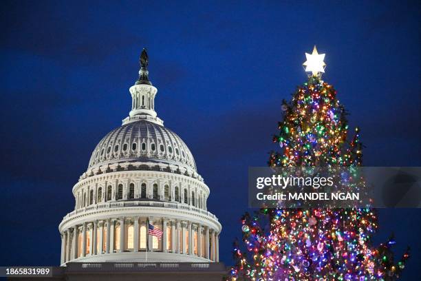 The Capitol Christmas tree is seen on the West Front of the US Capitol in Washington, DC on December 21, 2023. The tree is a 63-foot Norway spruce...