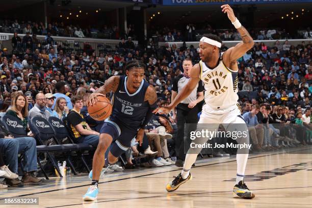 Ja Morant of the Memphis Grizzlies drives to the basket during the game against the Indiana Pacers on December 21, 2023 at FedExForum in Memphis,...