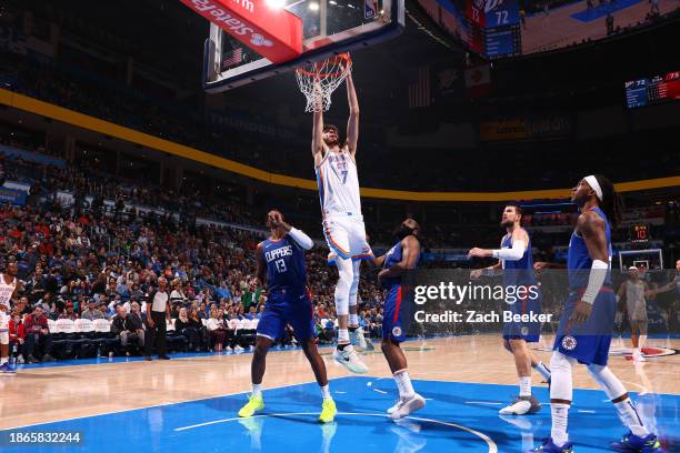 Chet Holmgren of the Oklahoma City Thunder dunks the ball during the game against the LA Clippers on December 21, 2023 at Paycom Arena in Oklahoma...