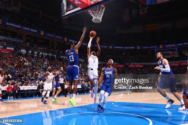 Shai Gilgeous-Alexander of the Oklahoma City Thunder shoots the ball during the game against the LA Clippers on December 21, 2023 at Paycom Arena in...