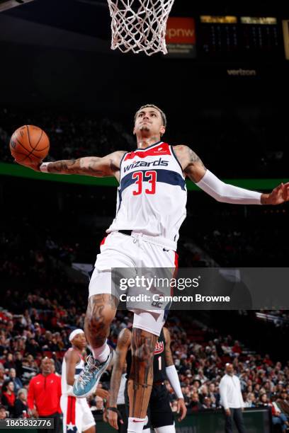 Kyle Kuzma of the Washington Wizards dunks the ball during the game against the Portland Trail Blazers on December 21, 2023 at the Moda Center Arena...