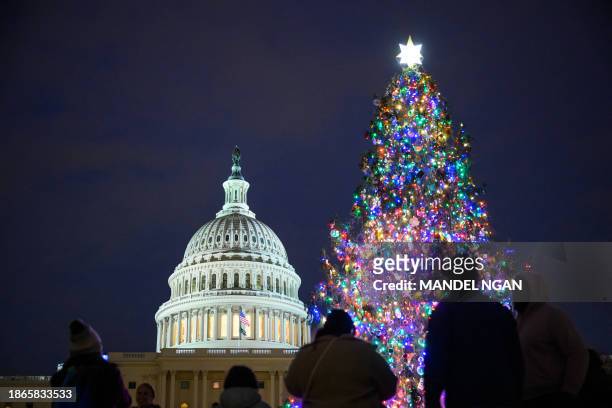The Capitol Christmas tree is seen on the West Front of the US Capitol in Washington, DC on December 21, 2023. The tree is a 63-foot Norway spruce...