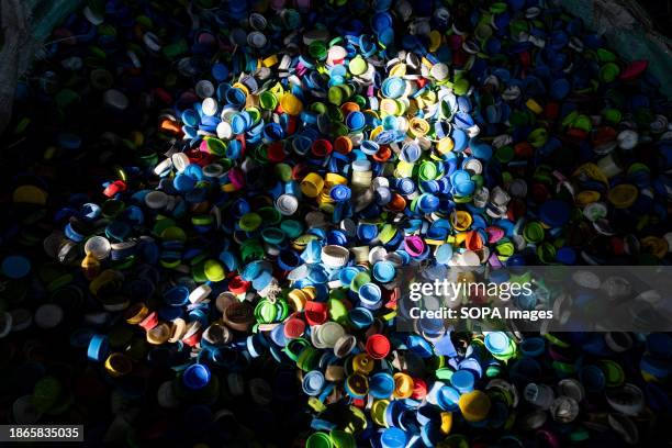 Plastic bottle caps at a sorting and compacting facility in Bang Phli in Samut Prakan. Out of the 8 million tons of plastic waste the country...