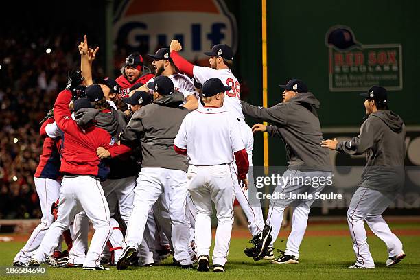 The Boston Red Sox celebrate after defeating the St. Louis Cardinals in Game Six of the 2013 World Series at Fenway Park on October 30, 2013 in...