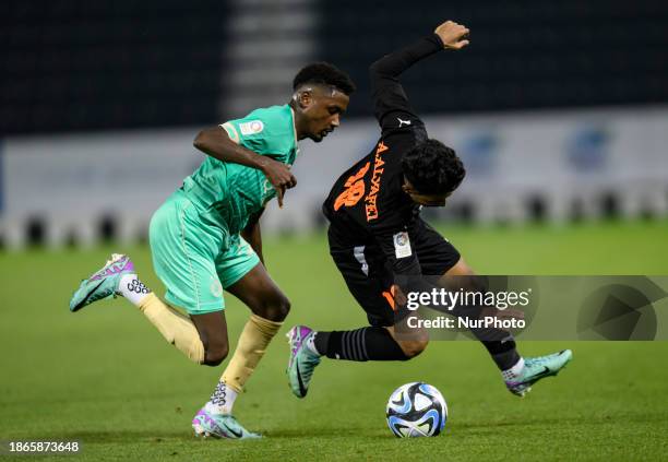 Musaab Khidir Mohamed of Al-Sadd SC and Abdullah Khaled Sheikh of Umm Salal SC are competing during the EXPO Stars League 23/24 match between Al-Sadd...