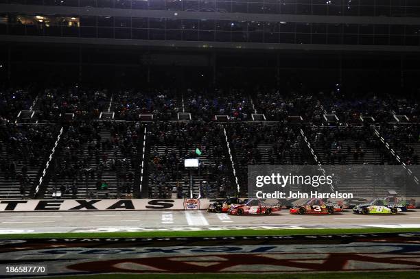 Jeb Burton, driver of the Arrowhead Chevrolet, and Justin Lofton, driver of the Lofton Cattle Chevrolet, lead the field to the green flag for the...