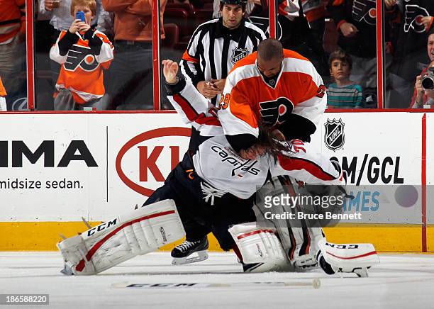 Ray Emery of the Philadelphia Flyers fights with Braden Holtby of the Washington Capitals during the third period at the Wells Fargo Center on...