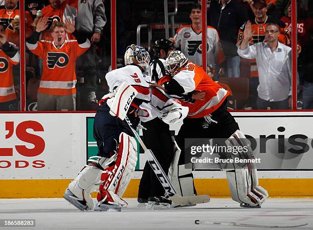 Ray Emery of the Philadelphia Flyers fights with Braden Holtby of the Washington Capitals during the third period at the Wells Fargo Center on...