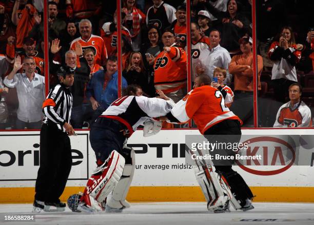 Ray Emery of the Philadelphia Flyers fights with Braden Holtby of the Washington Capitals during the third period at the Wells Fargo Center on...