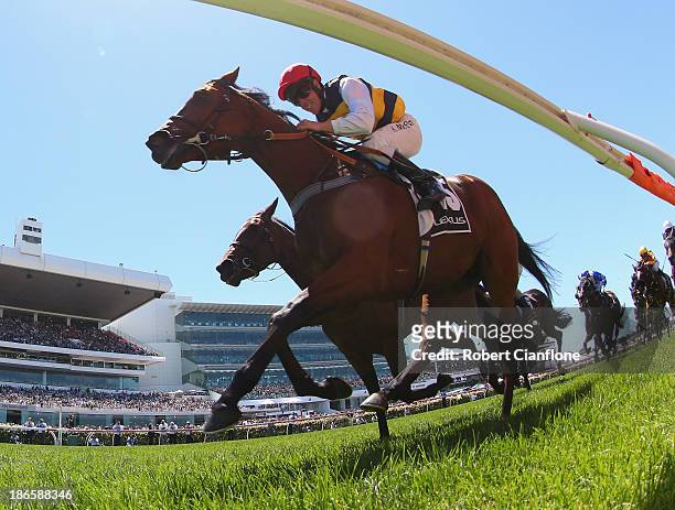 Kerrin McEvoy riding Ruscello crosses the line to win race three the Lexus Stakes during Derby Day at Flemington Racecourse on November 2, 2013 in...