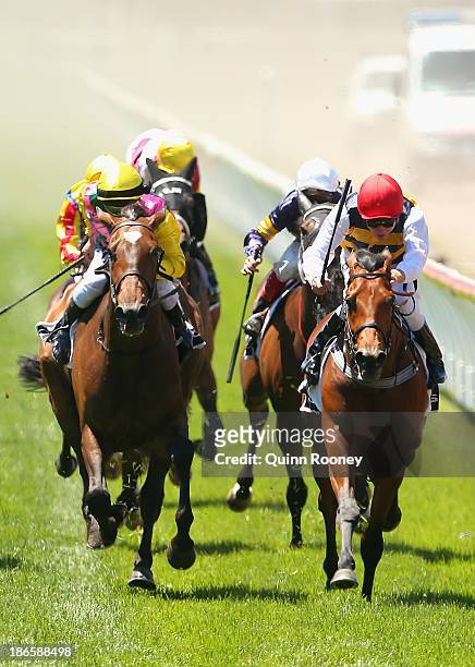 Kerrin McEvoy riding Ruscello crosses the line to win race 3 Lexus Stakes during Derby Day at Flemington Racecourse on November 2, 2013 in Melbourne,...