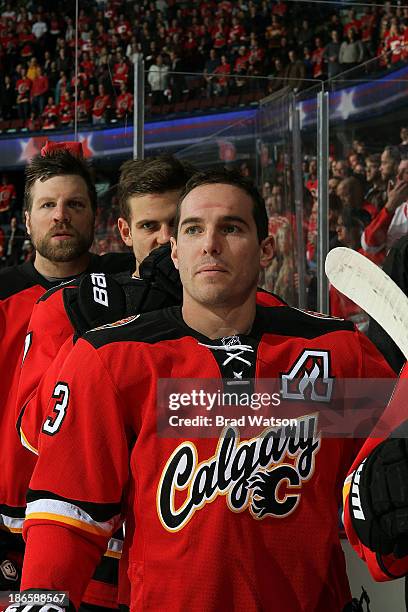 Michael Cammalleri of the Calgary Flames stands on the bench during the national anthems before the game against the Detroit Red Wings at Scotiabank...