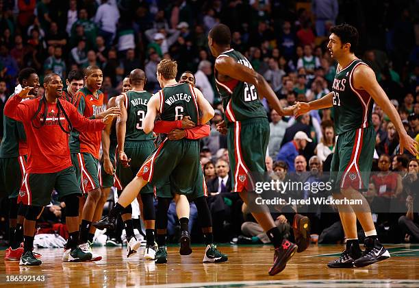 Members of the Milwaukee Bucks including O.J. Mayo and Nate Wolters celebrate in the fourth quarter after taking the lead against the Boston Celtics...