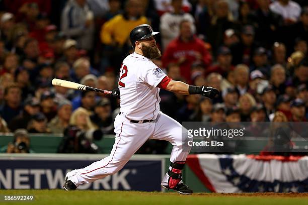 Mike Napoli of the Boston Red Sox in action against the St. Louis Cardinals during Game Six of the 2013 World Series at Fenway Park on October 30,...