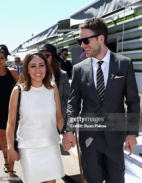 Hamish Blake and Zoe Foster arrive on Victoria Derby Day at Flemington Racecourse on November 2, 2013 in Melbourne, Australia.