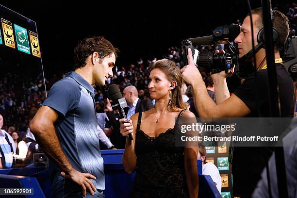 Tennis player Roger Federer interviewed by former tennis player and journalist Tatiana Golovin after his match during day five of BNP Paribas Tennis...