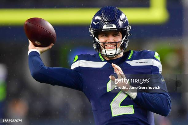 Drew Lock of the Seattle Seahawks warms up before a game against the Philadelphia Eagles at Lumen Field on December 18, 2023 in Seattle, Washington.