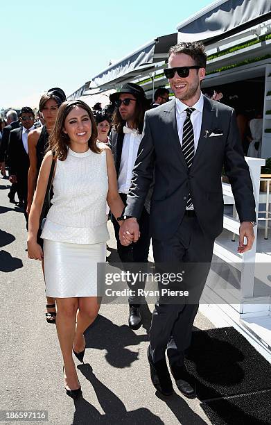 Hamish Blake and Zoe Foster arrive on Victoria Derby Day at Flemington Racecourse on November 2, 2013 in Melbourne, Australia.