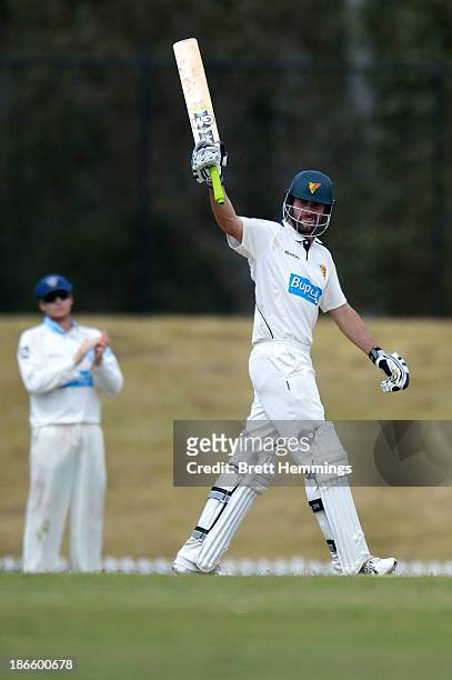 Alex Doolan of the Tigers celebrates his century during day four of the Sheffield Shield match between the New South Wales Blues and the Tasmania...