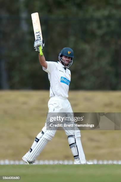 Alex Doolan of the Tigers celebrates his century during day four of the Sheffield Shield match between the New South Wales Blues and the Tasmania...