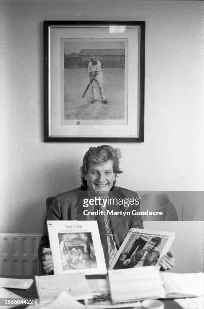Bob Willis, English cricketer who played for Surrey, Warwickshire, and England, portrait holding Bob Dylan album , United Kingdom, 1990.