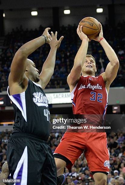 Blake Griffin of the Los Angeles Clippers shoots over Chuck Hayes of the Sacramento Kings during the third quarter at Sleep Train Arena on November...