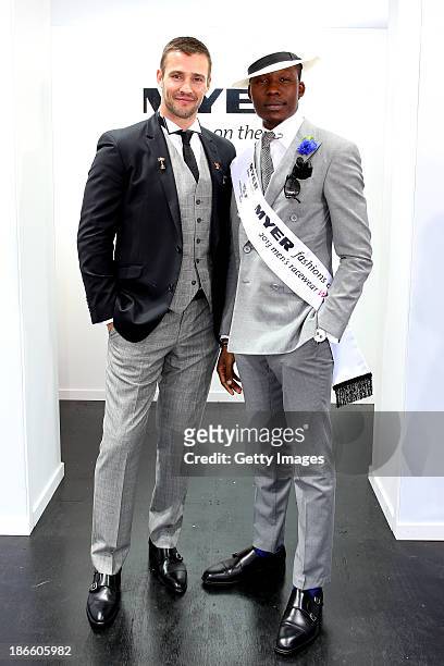 Myer Fashions on the Field Men's Racewear daily winner, Palmer Mutandwa poses with Kris Smith, on AAMI Derby Day at Flemington Racecourse on November...