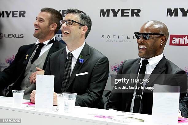 Myer Fashions on the Field judges Kris Smith, Adam Stapleton and Tyson Beckford look on at contestants, on Victoria Derby Day at Flemington...