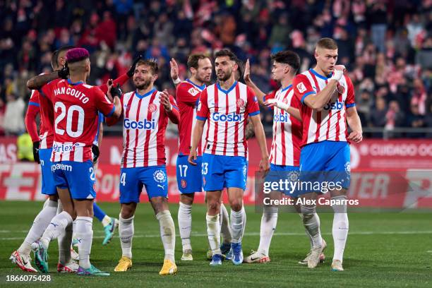 Artem Dovbyk of Girona FC celebrates with teammates after scoring their team's third goal with a penalty kick during the LaLiga EA Sports match...