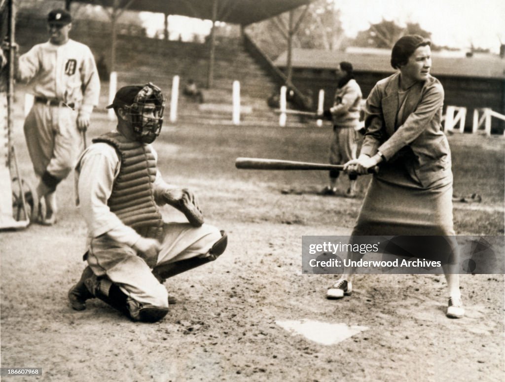 Woman Tennis Star At Bat