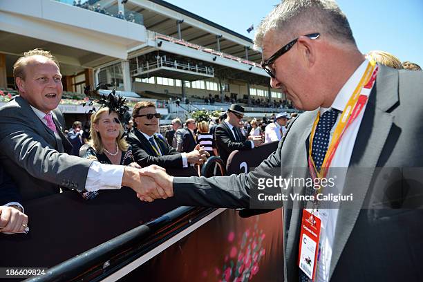 Trainer Ed Dunlop congratulates owner Simon O'Donnell after Ruscello won race 3 the Lexus Stakes during Derby Day at Flemington Racecourse on...