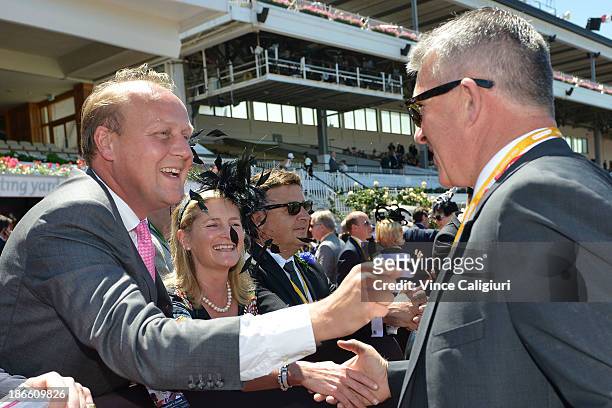 Trainer Ed Dunlop congratulates owner Simon O'Donnell after Ruscello won race 3 the Lexus Stakes during Derby Day at Flemington Racecourse on...