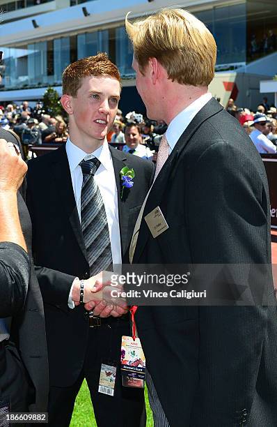 Chad Schofield congratulates Trainer Ed Walker after Ruscello won race 3 the Lexus Stakes during Derby Day at Flemington Racecourse on November 2,...