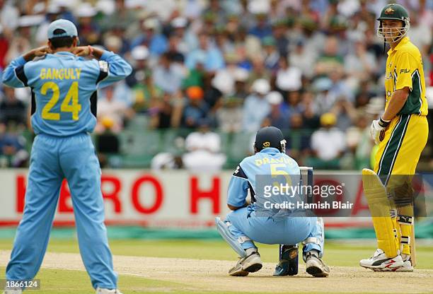 Adam Gilchrist of Australia speaks with Sourav Ganguly of India after Ganguly claimed a catch from Gilchrist that was ruled not out during the World...