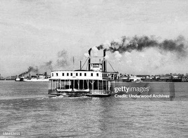 The car ferry boat 'Algiers' crossing the Mississippi River, New Orleans, Louisiana, early 1930s.