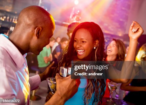 Happy Couple Clubbing High-Res Stock Photo - Getty Images