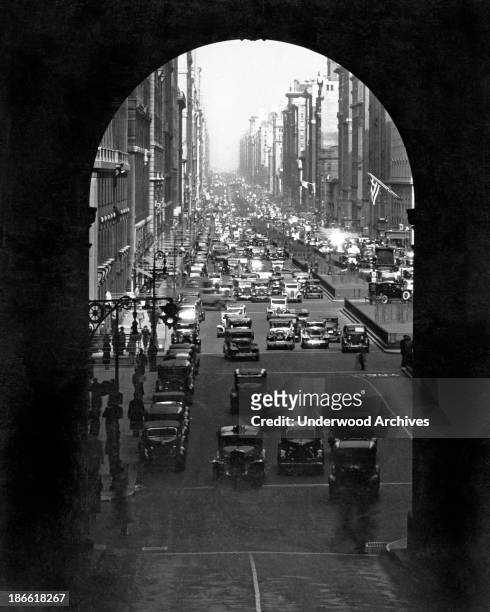 The dramatic archway entrance to Grand Central Station in Manhattan, New York, New York, late 1920s or early 1930s. Photo looks north on Park Avenue.