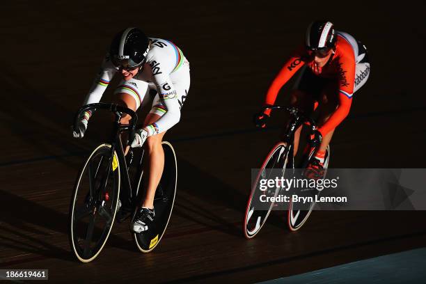 Rebecca James of Great Britain rides against Elis Lightee of The Netherlands in race one of the Women's Sprint Quarter Finals on day two of the UCI...