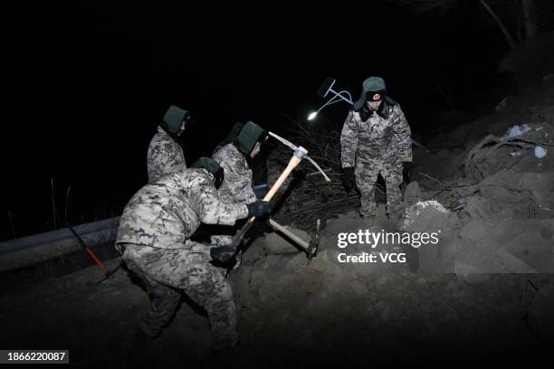 Rescuers clear the debris of houses after a 6.2-magnitude earthquake on December 19, 2023 in Jishishan Bonan, Dongxiang and Salar Autonomous County,...