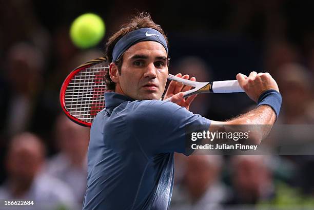 Roger Federer of Switzerland in action against Novak Djokovic of Serbia during day six of the BNP Paribas Masters at Palais Omnisports de Bercy on...