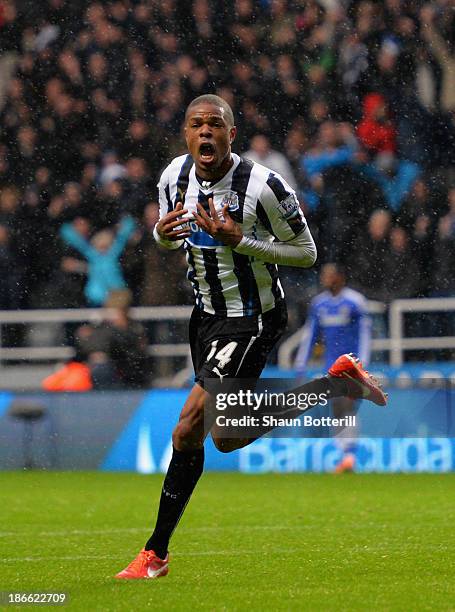 Loic Remy of Newcastle United celebrates scoring their second goal during the Barclays Premier League match between Newcastle United and Chelsea at...