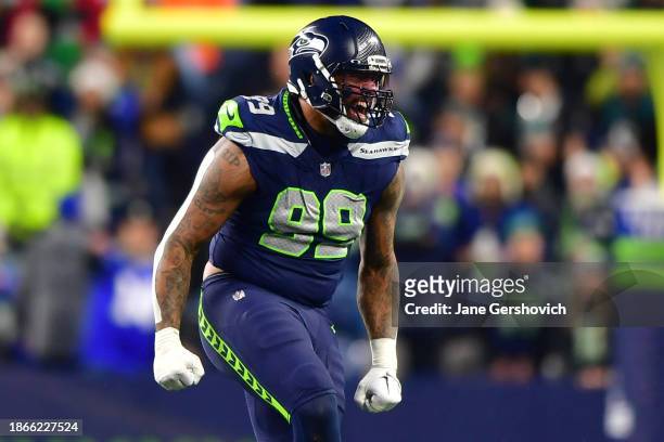 Leonard Williams of the Seattle Seahawks celebrates after a tackle in the third quarter at Lumen Field on December 18, 2023 in Seattle, Washington.